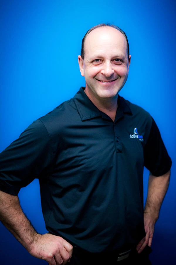 Dr. Michael Muzzin, chiropractor and founder of Active Care Health